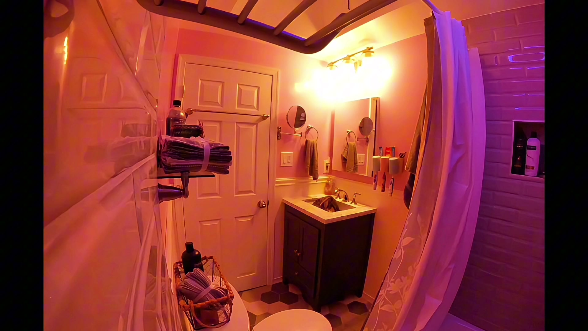 Mayfair hall bath remodel with subway-tile shower, hex floor, and white vanity