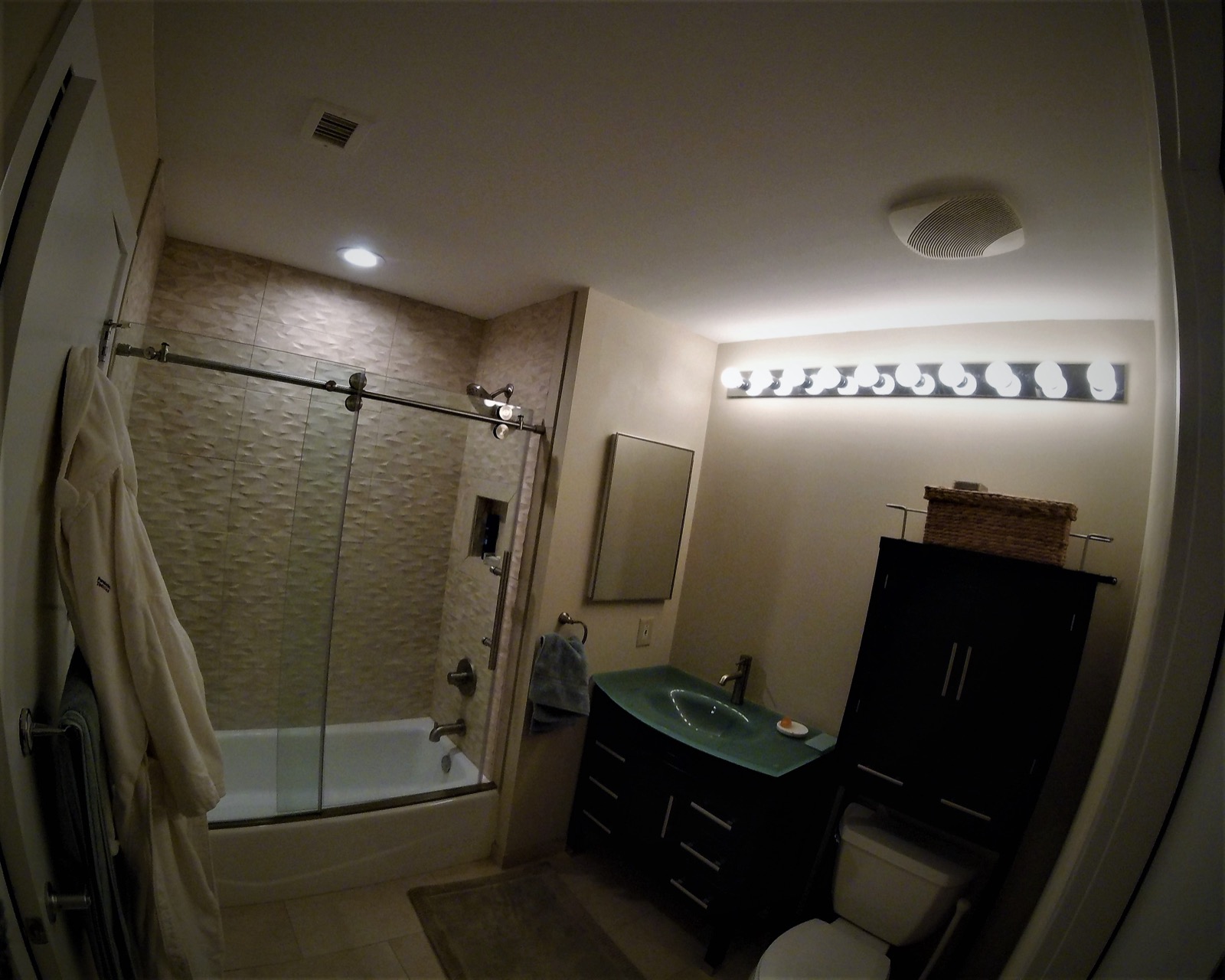 South Philly Dockside bathroom remodel after — glass shower and glass-top vanity